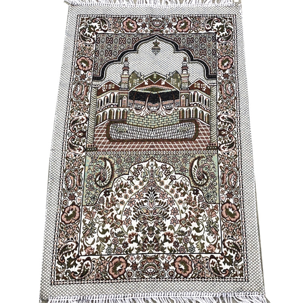 Un tapis de prière musulman gris brodé sur un fond blanc.